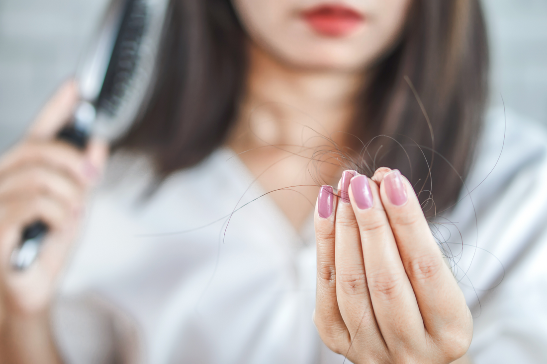 Common Causes of Female Hair Loss. Image of blonde wavy hair woman.